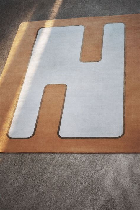 fendi casa yellow sign carpet.